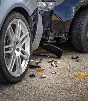 Car accident lawyer reviewing a case with attention to all injuries, damages, and insurance company defense tactics, helping clients understand their rights and the best way to seek results